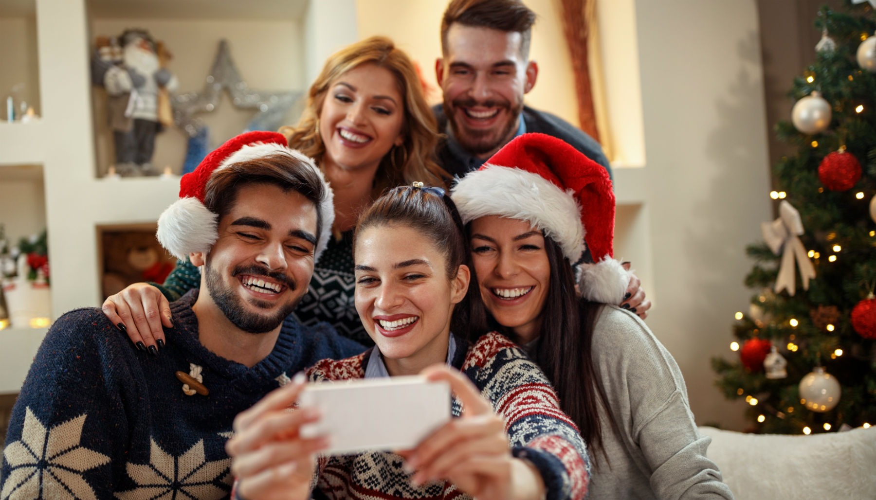 family taking a selfie during Christmas