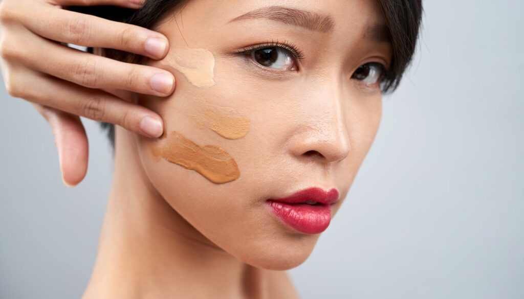 woman with different shades of foundation on her face