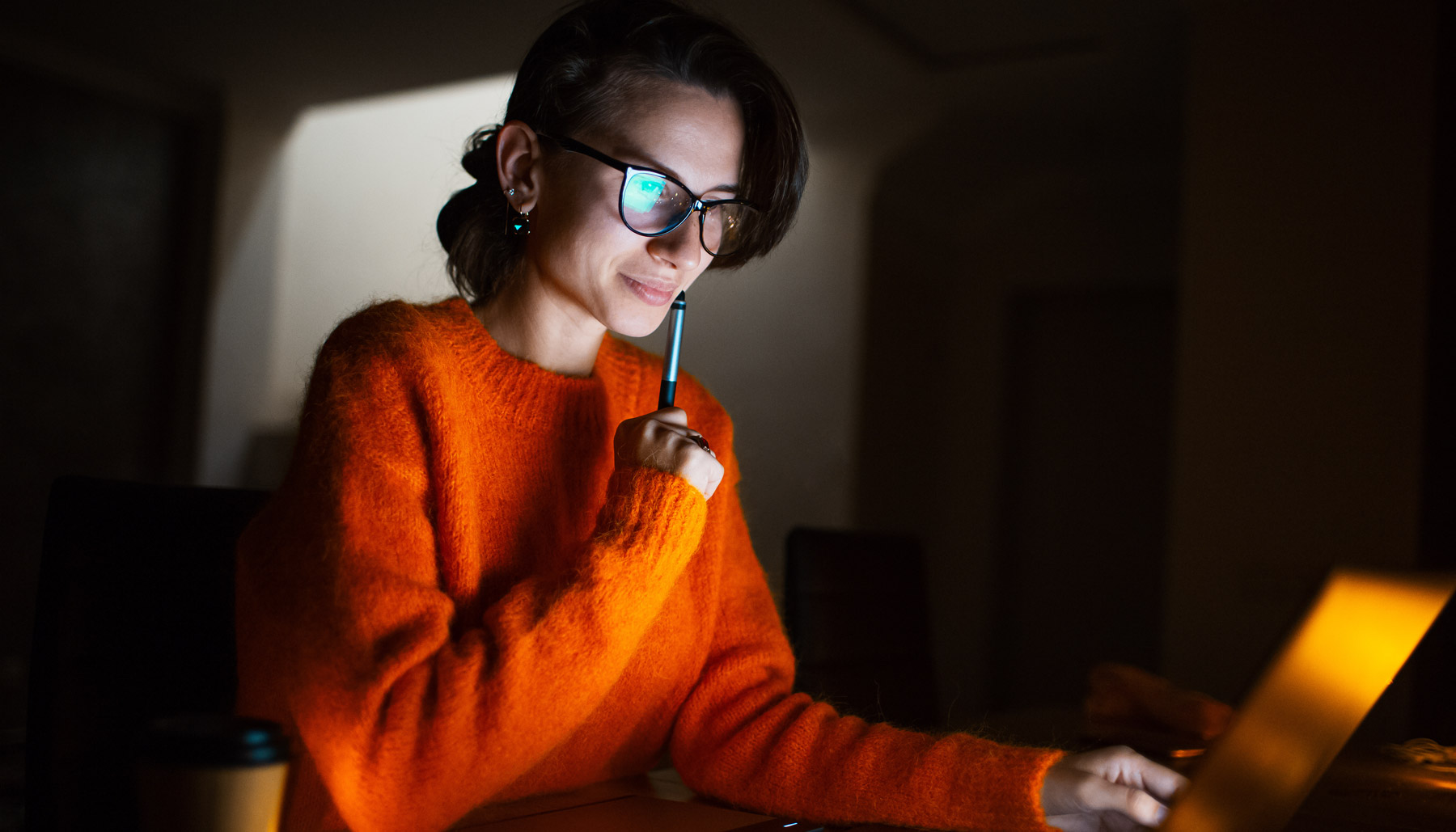 Woman with glasses on computer