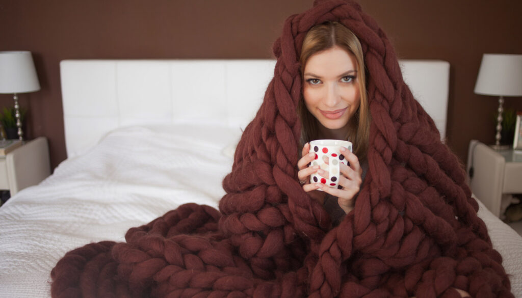 Woman wrapped up in blanket