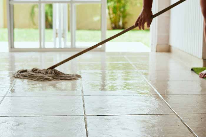 mopping a tile floor