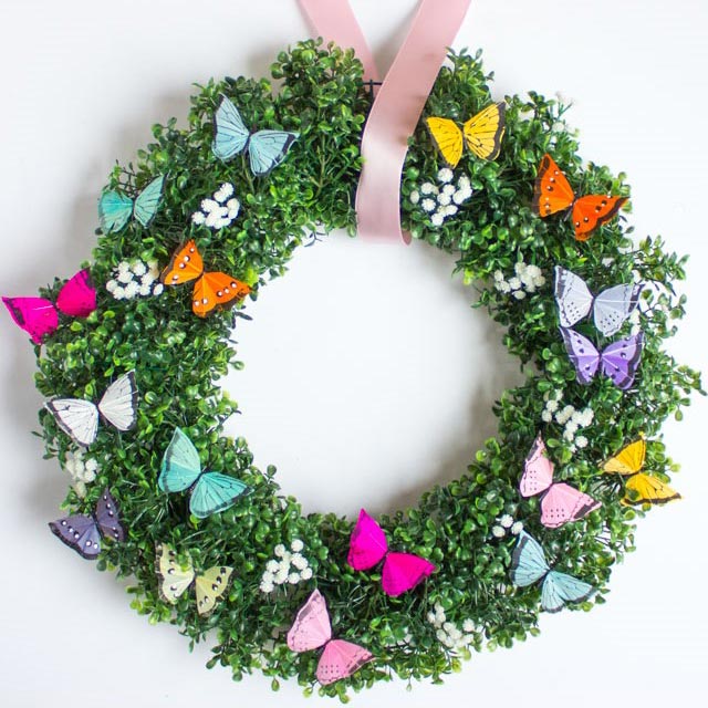 spring wreath covered in butterflies