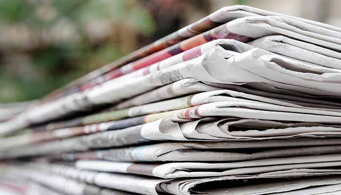 closeup of a stack of newspapers