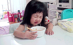 kid crying and eating