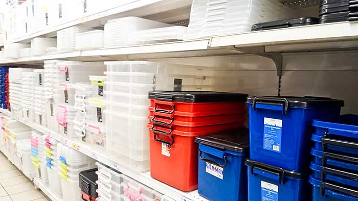 plastic storage bins on a store shelf