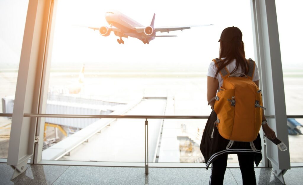 woman looking at a plane