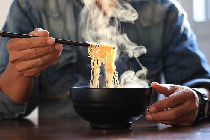 eating ramen with chopsticks