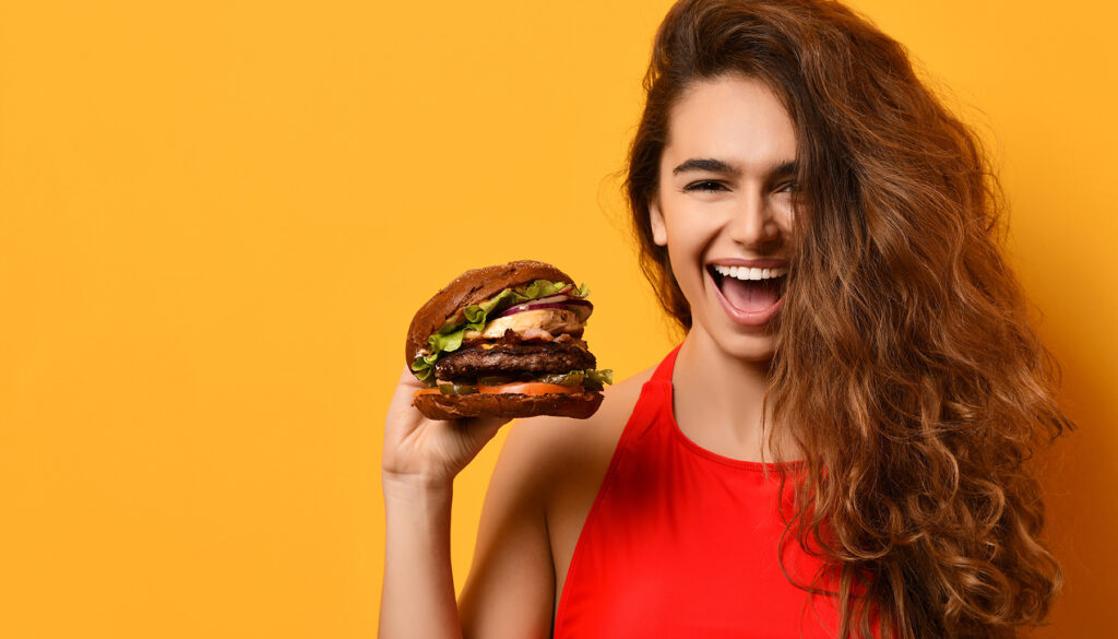 young-woman-holds-giant-burger