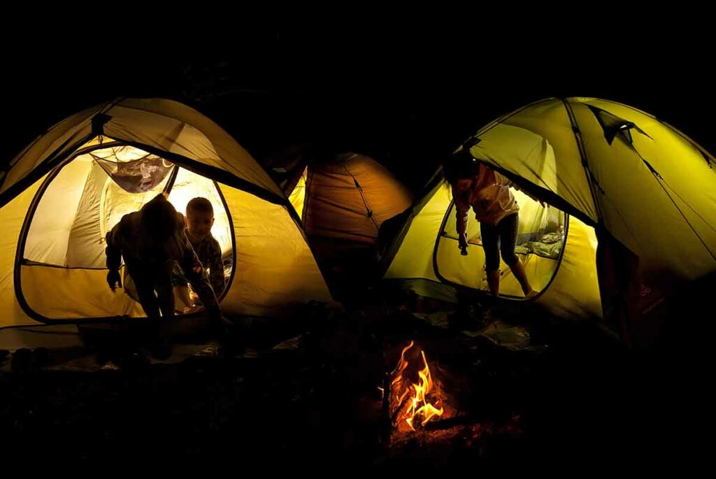 kids in camping tents at night