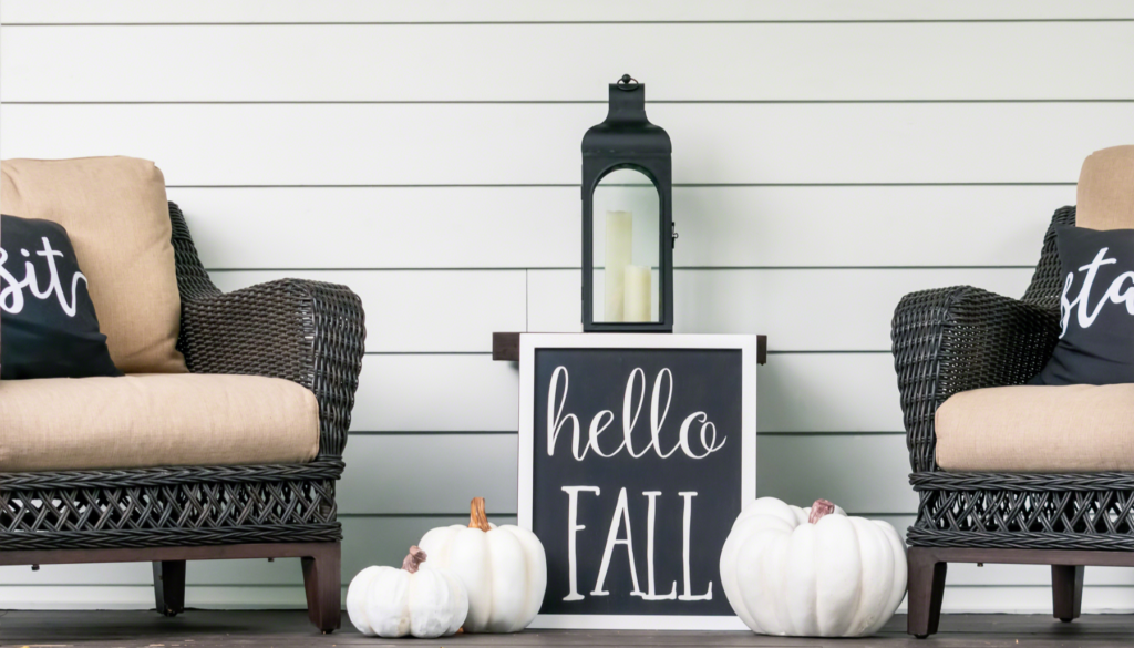 Fall chairs, signs, decorations, and white pumpkins