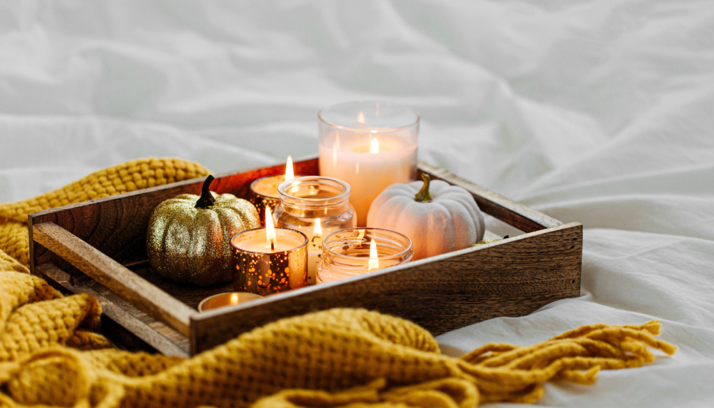Tray with candles and yellow blanket