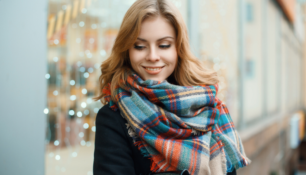 Woman wearing plaid wool scarf