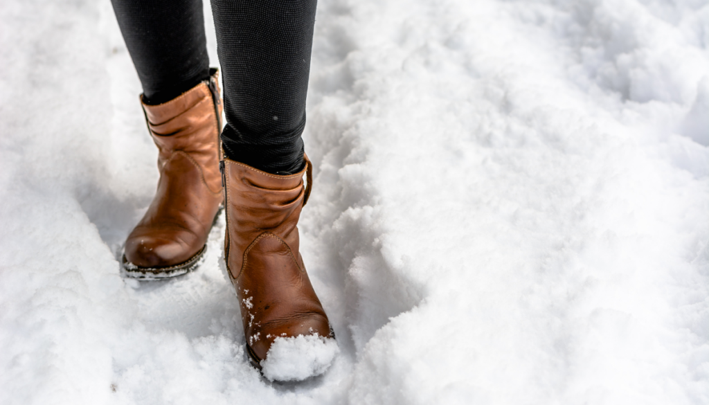 Boots walking through snow