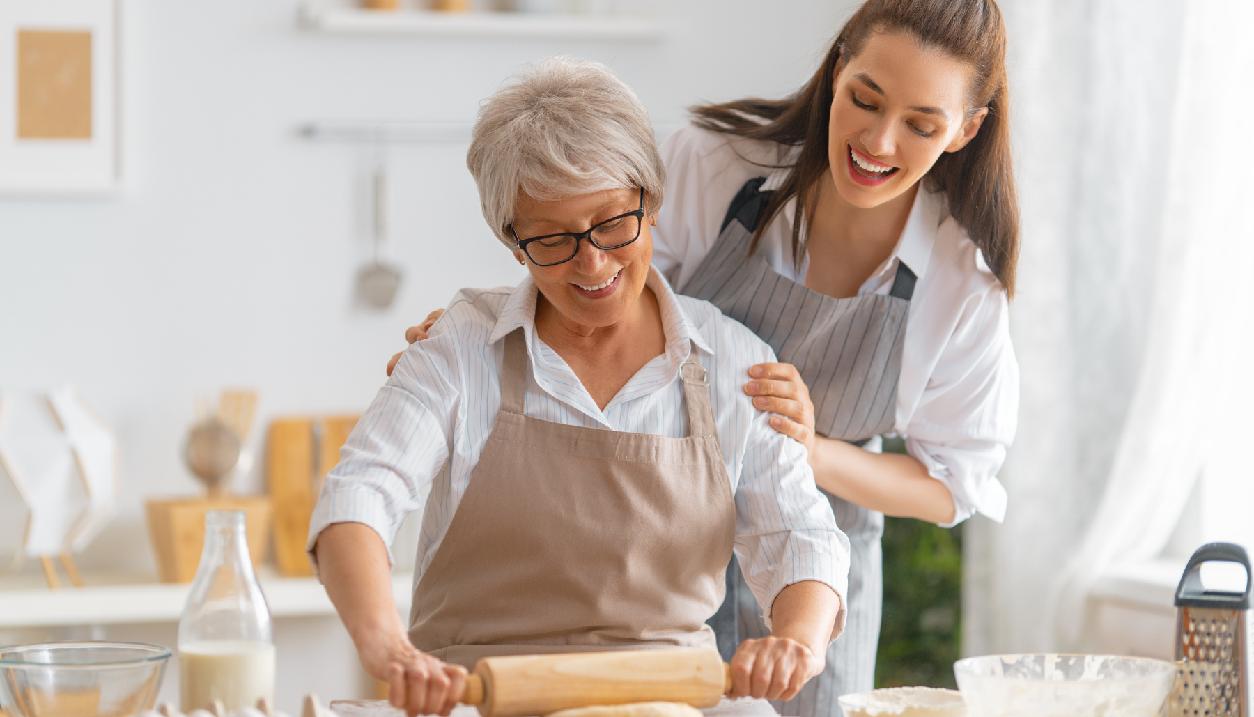 Young woman and older woman baking together
