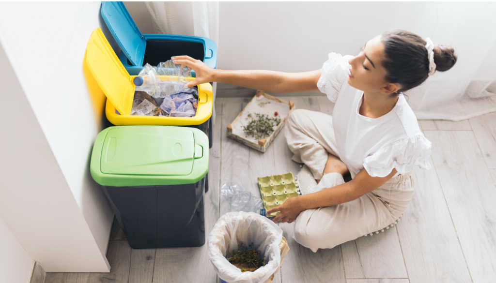 Woman sitting on floor and sorting recycling