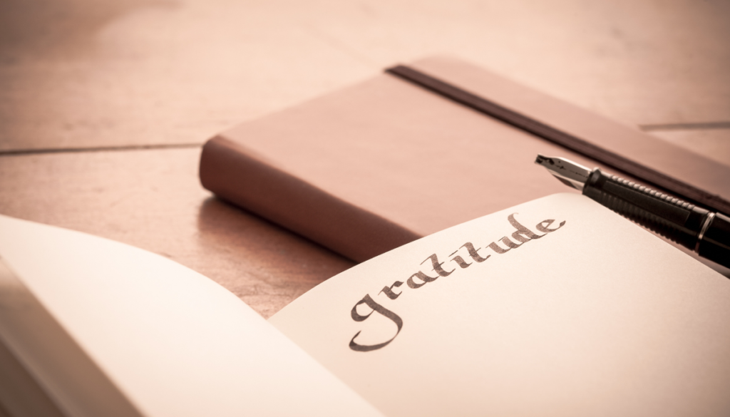 Sepia tone photo of gratitude journal