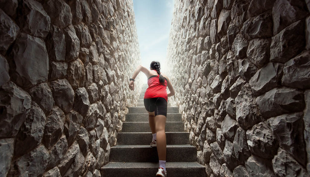 Woman running up the stairs