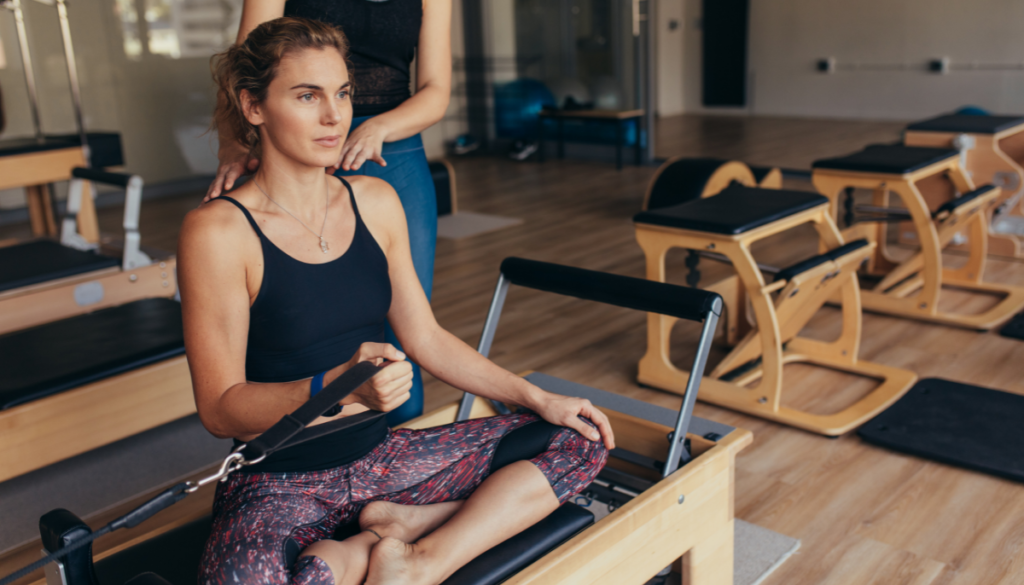 Woman doing Pilates with machine