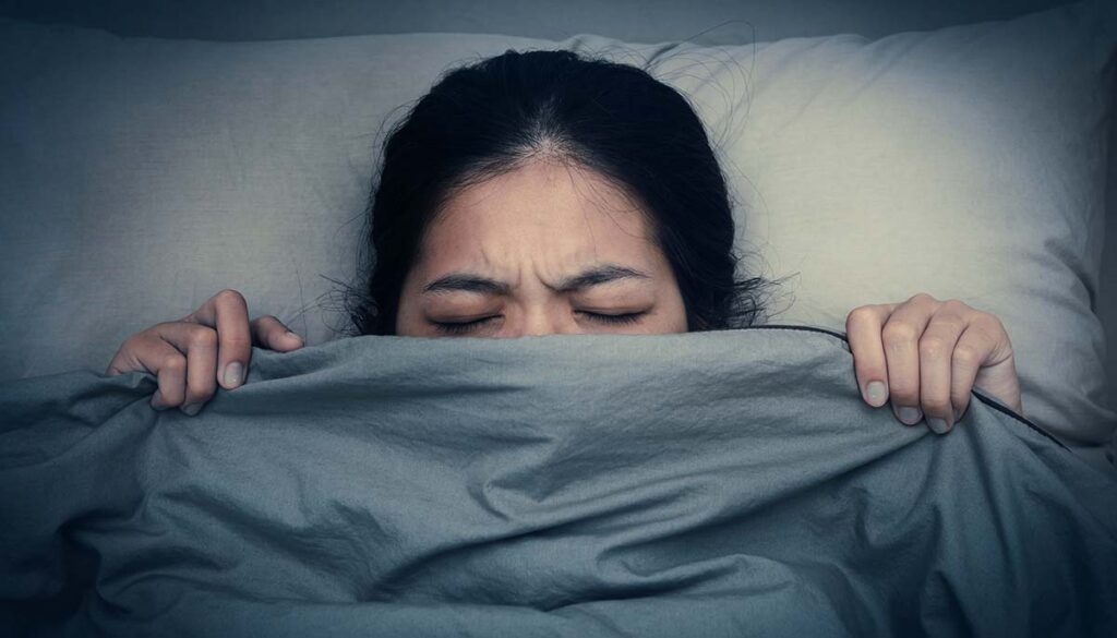 Asian woman unable to fall as sleep in the night time. Asian girl having trouble with getting up early in the morning, Nightmare.