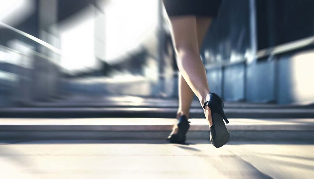 woman running away in high heels