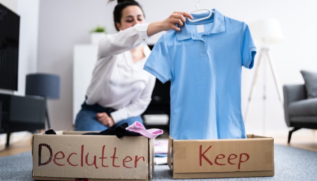 Woman choosing to declutter or keep clothes