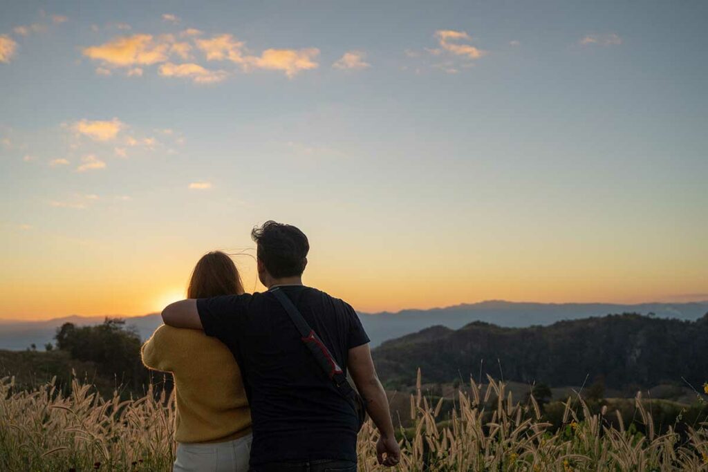 couple watching the sunrise together