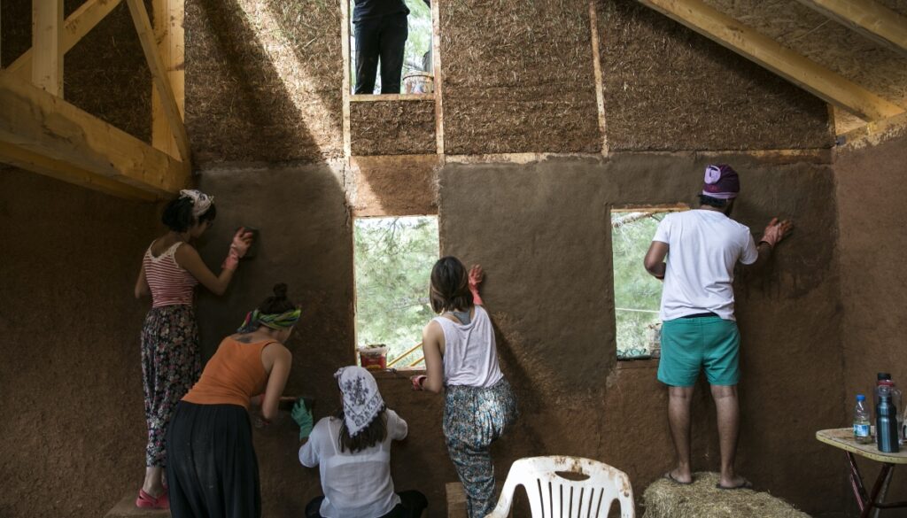 a group of people building a house together
