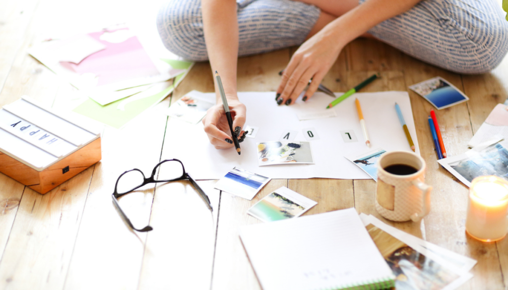 Person sitting on floor crafting