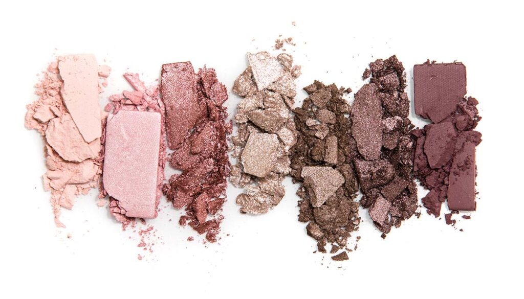neutral tone eyeshadows crushed side by side on white background