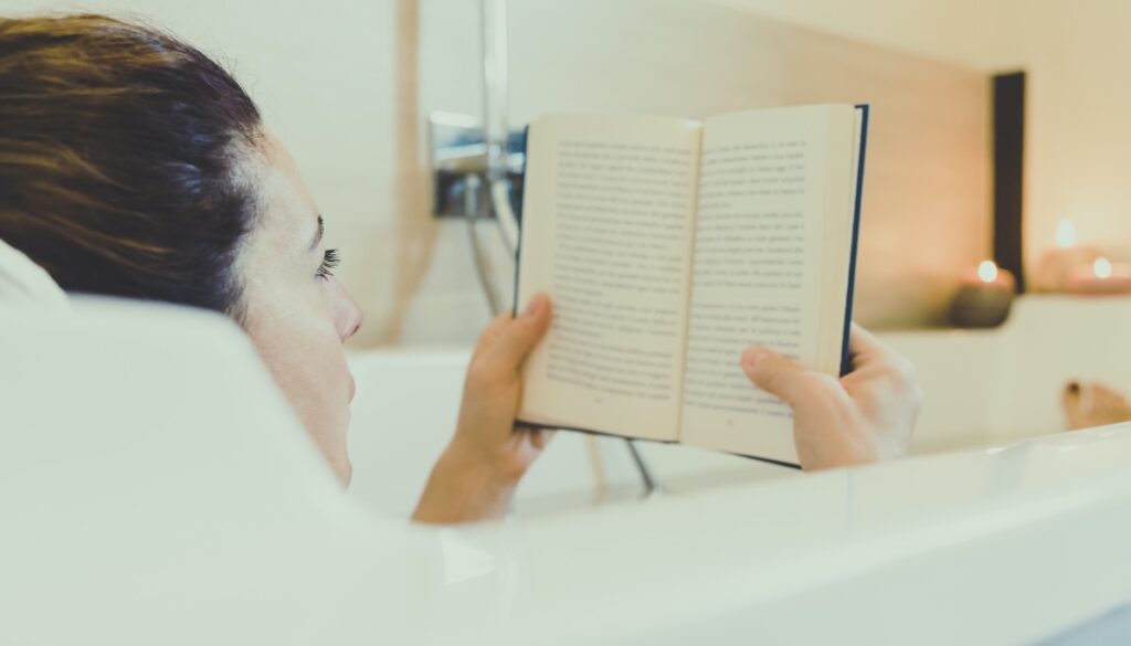 woman reading in a bathtub