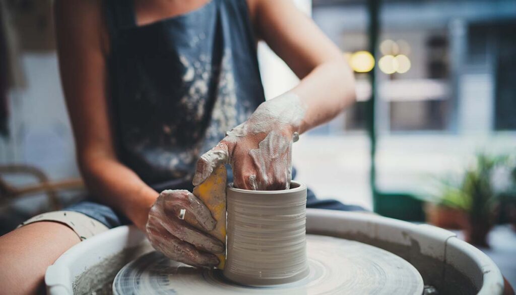 woman doing ceramics in public studio