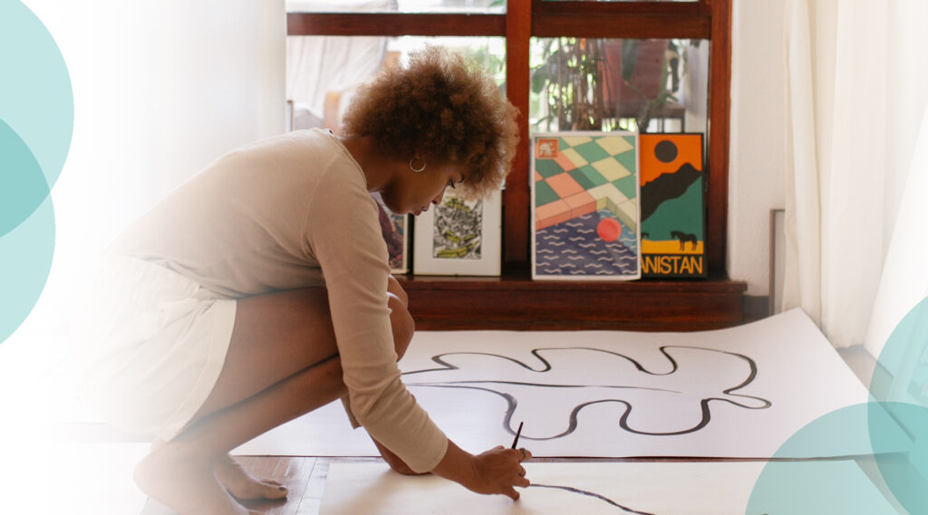 Woman drawing on the floor