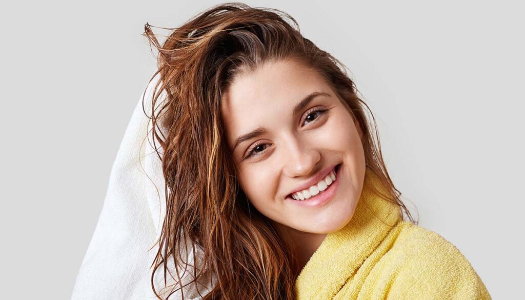 woman towel drying her hair