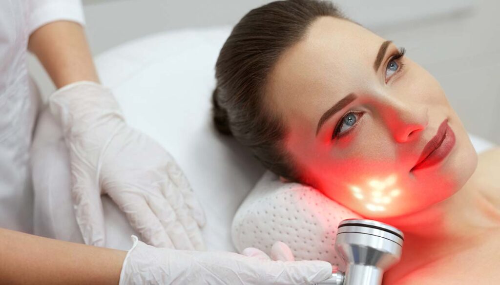 woman getting red light led therapy facial