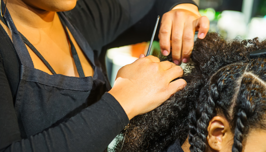 Woman parting hair at salon