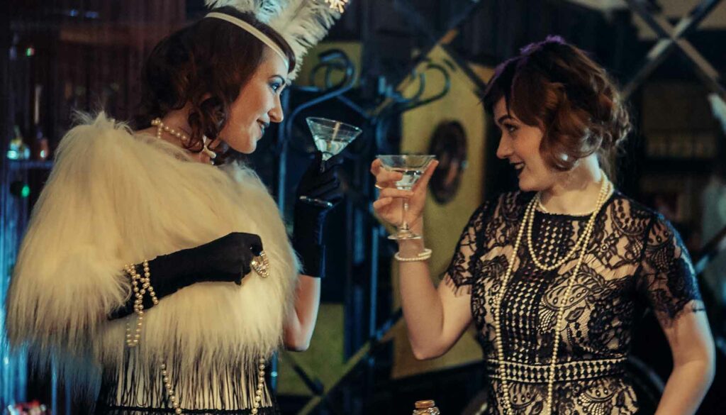 two women dressed as flappers in Roaring '20s