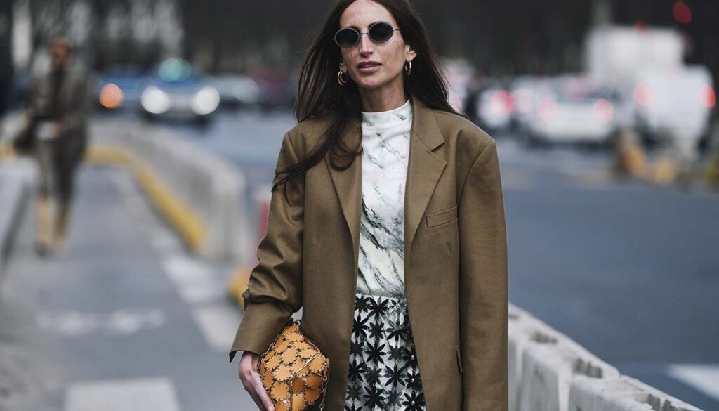 stylish woman on streets of Paris in flower print sheer skirt 