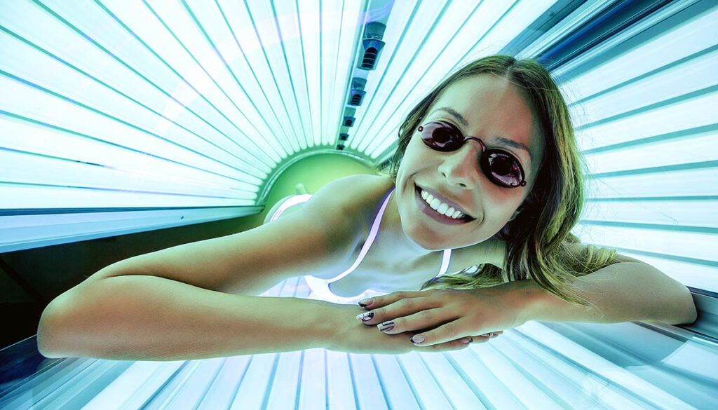 Woman using a tanning bed