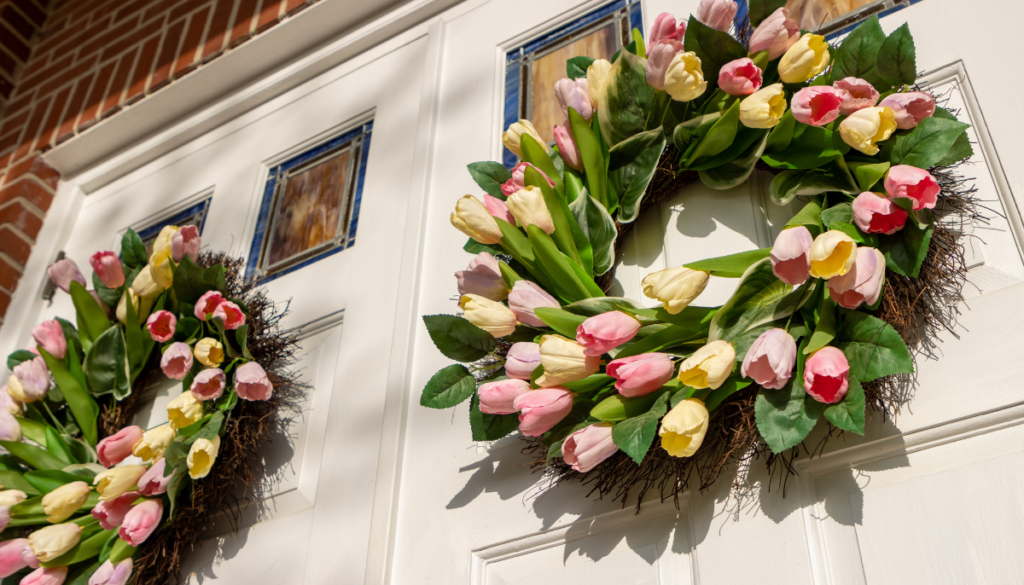 Two tulip wreaths on a front door