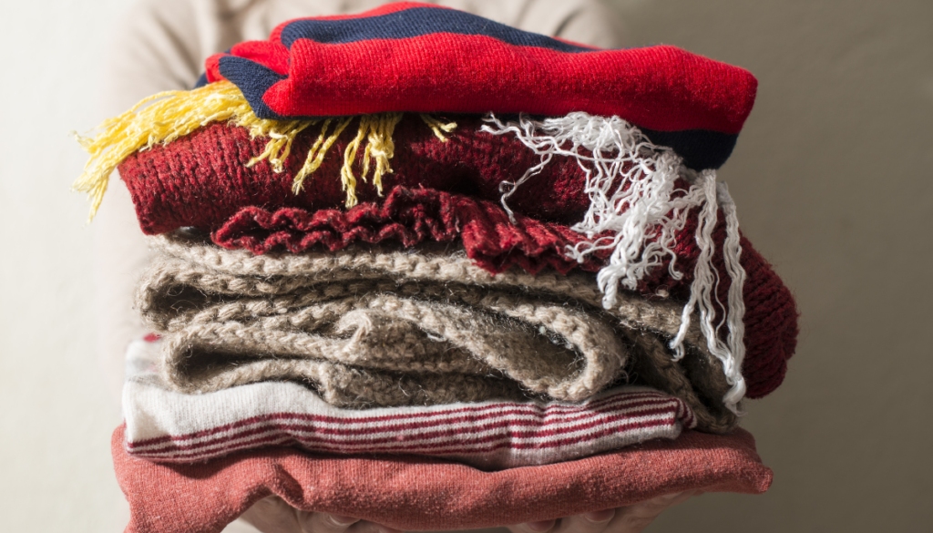 Stack of scarves and winter clothes