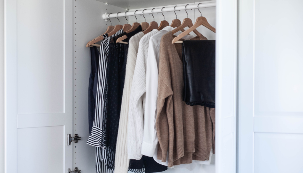 Closet with neutral clothes and identical hangers