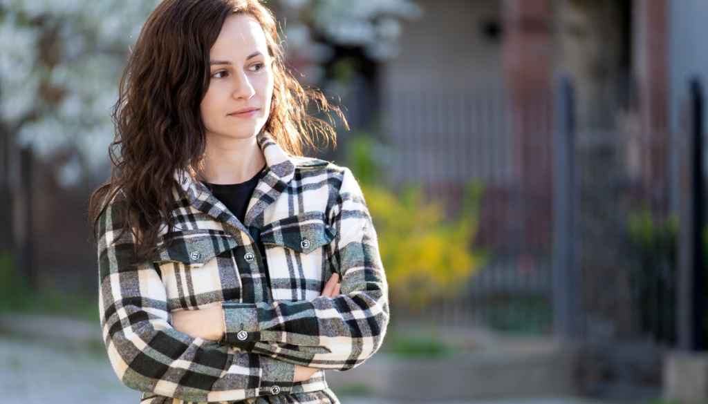 Woman looking unhappy walking outside