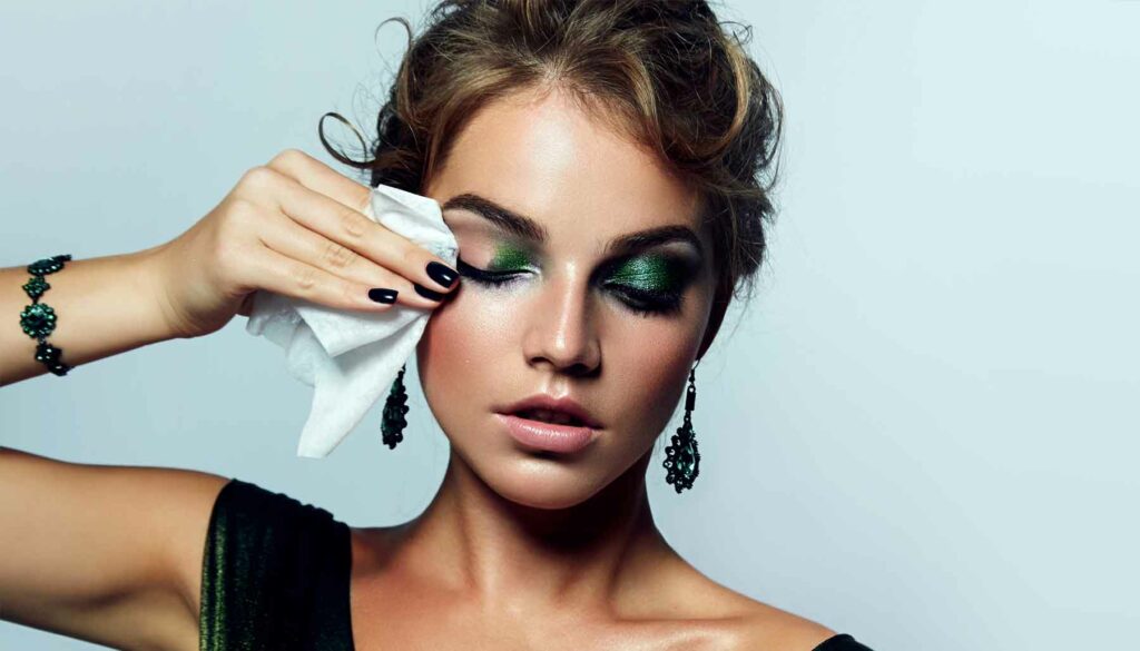 woman removing makeup with wipes