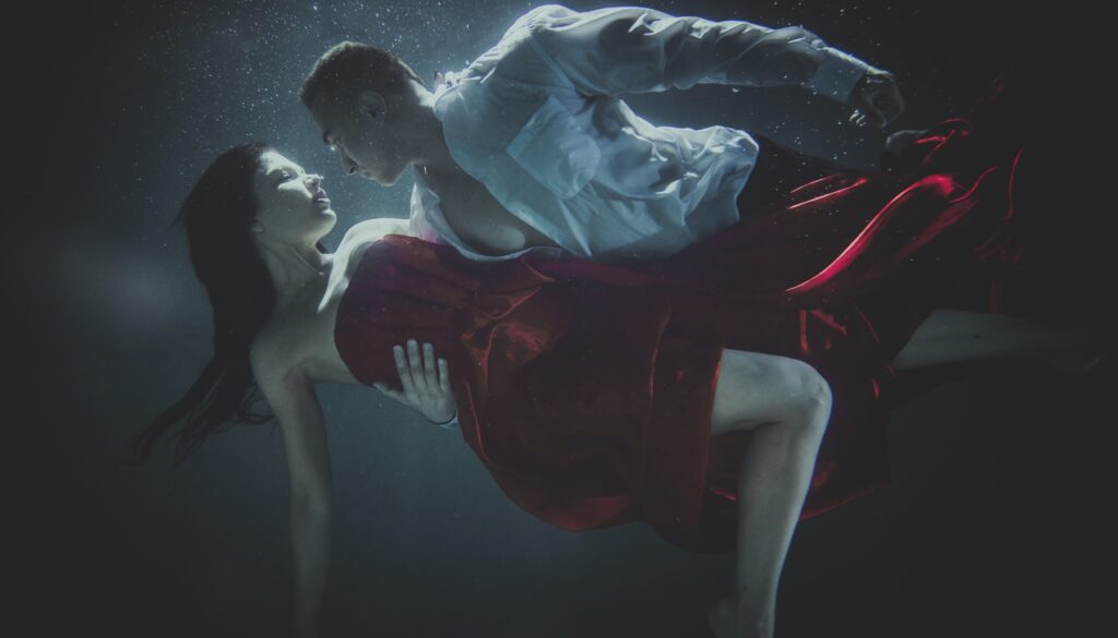 couple embracing underwater