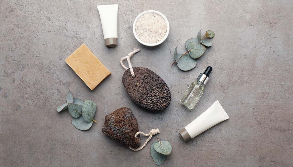 Flat lay composition with pumice stones on grey background