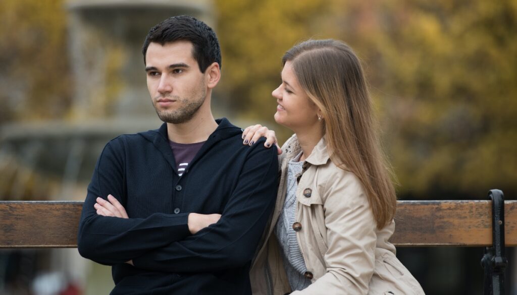 woman tries to get her stoic partners attention