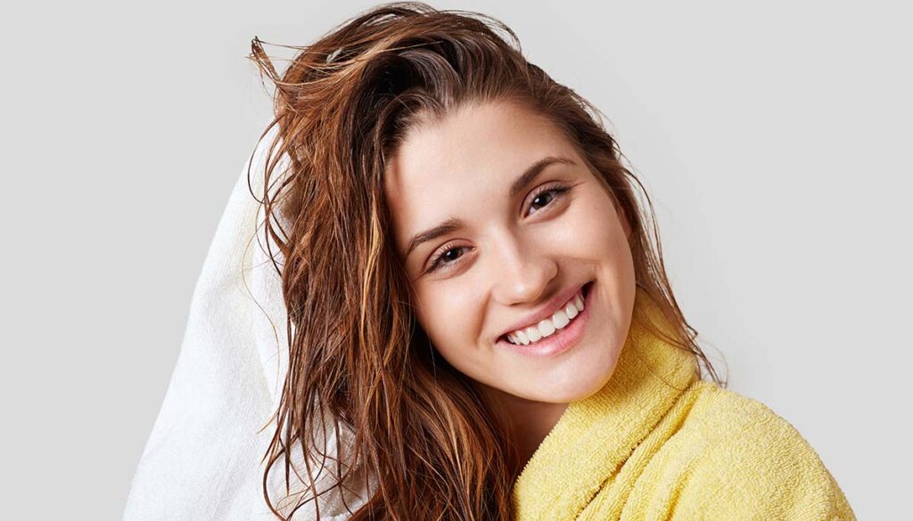 woman letting hair air dry after shower