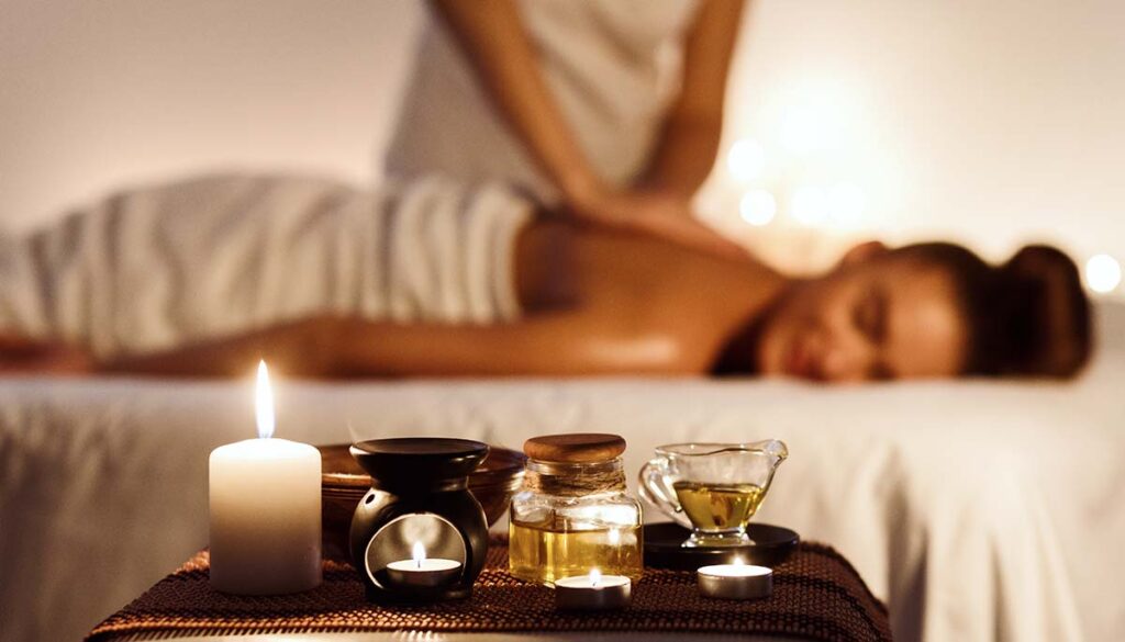 Woman enjoying massage in luxury spa  with aromatherapy