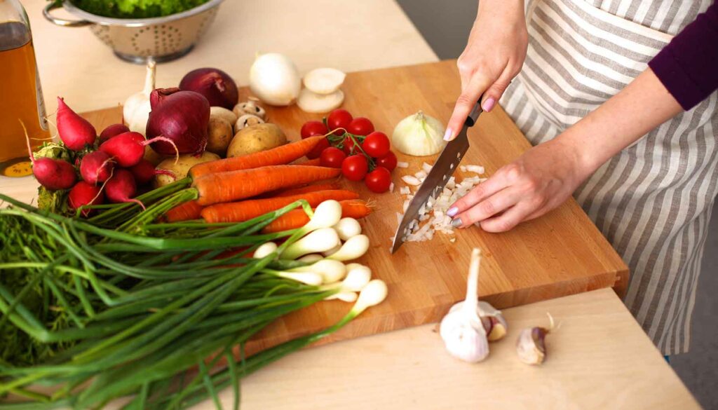 chopping vegetables on a cutting board