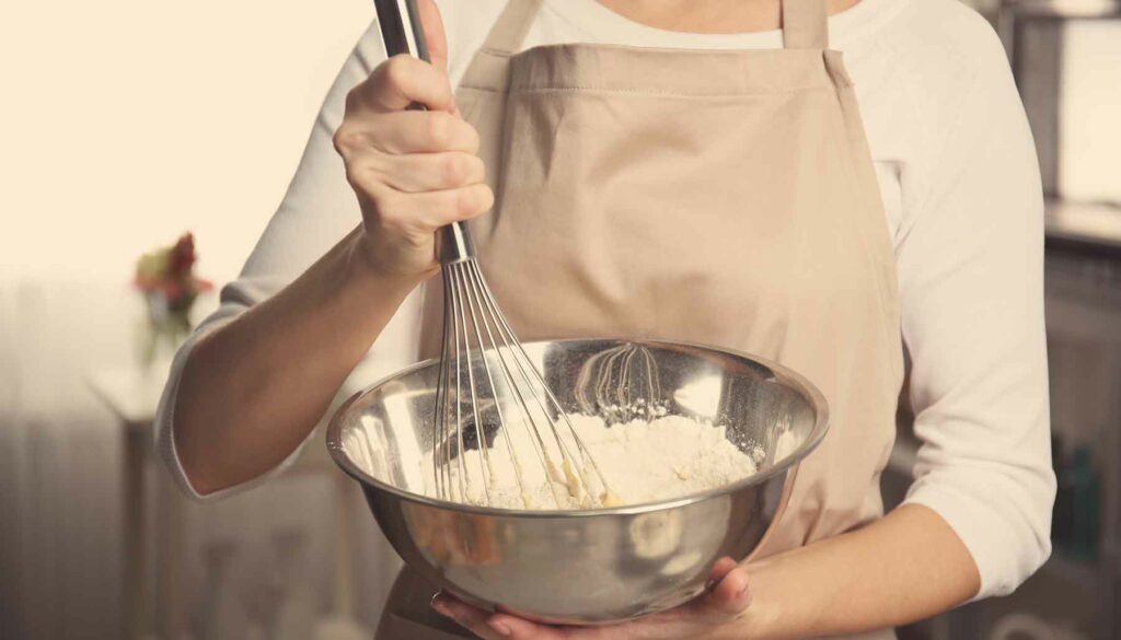 whisking in a mixing bowl